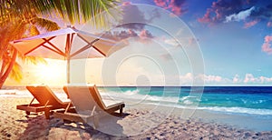 Two Deckchairs Under Parasol In Tropical Beach