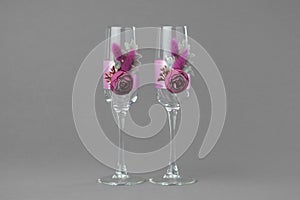 Two decorated wedding wine glasses.