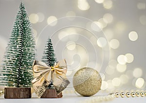 Two decorative Christmas trees and gifts for the new year on the bokeh background, Happy new year 2021