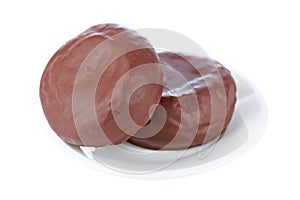 Two delicious chocolate donuts on a dish