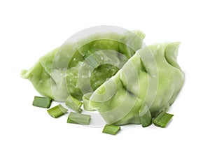 Two delicious green dumplings (gyozas) and onion isolated on white photo
