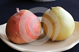 Two pears on a dish