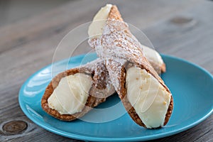 Two delicious typical Sicilian cannoli filled with ricotta chse cream photo