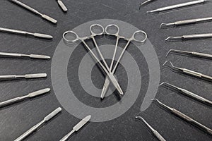 Two dental scissors with different dental instruments