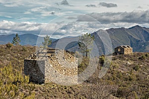 Two derelict stone buidings in Mountains near Venaco in Corsica