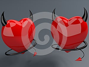 Two devil hearts on black