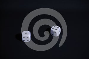 Two dice on black background