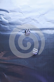 Two dice on silver background