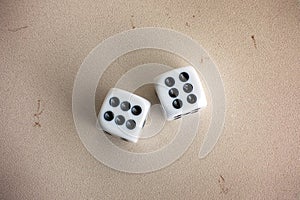 Two dice on stone background.