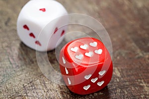 Two dices with hearts
