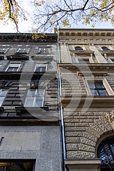 Two different building and a drain pipe in the middle