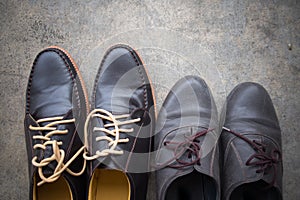 Two different Pairs of brown classic modern shoes