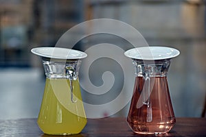 Two different syrup in carafes