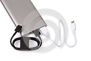 Two different USB cables connected to a power bank