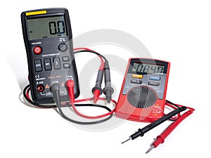 Two digital multimeters for electronics with probes. Black and red color. Whith red and black wires