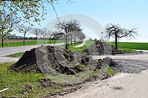 two dirt hills at the roadside