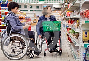 Two disabled women in a department store