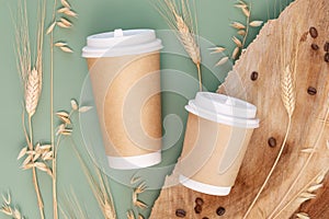 Two disposable cardboard cups with wheat and rye ears