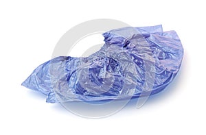 Two disposable medical blue plastic shoe covers