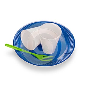 Two disposable plastic cups and green fork on blue plate on white