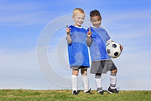 Two diverse young soccer players showing No. 1 sign