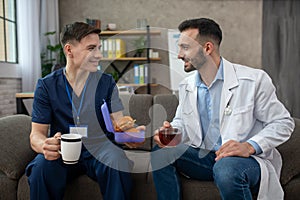 Two doctors having breakfast during the changeover