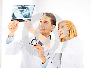 Two doctors looking at x-ray