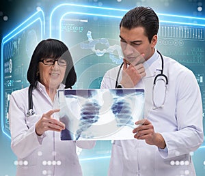 Two doctors looking at x-ray image