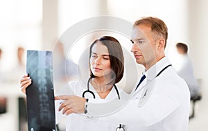 Two doctors looking at x-ray