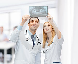 Two doctors looking at x-ray