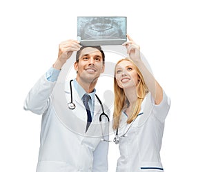 Two doctors looking at x-ray