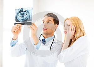 Two doctors looking at x-ray