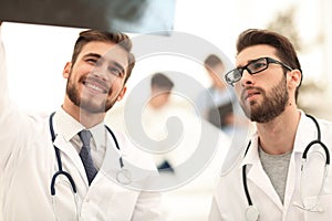 Two doctors looking at x-ray.