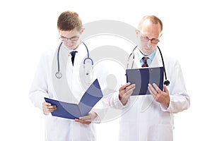 Two doctors reading patients records