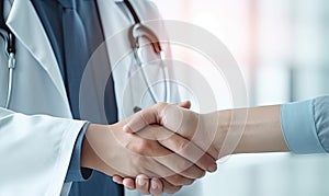 Two Doctors Shaking Hands With Stethoscope in Background