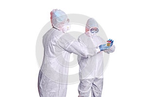 Two doctors in white paramedic uniforms isolated on a white backgrou