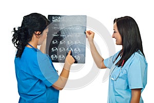 Two doctors women examine MRI