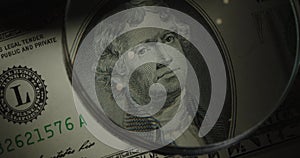 Two-dollar US banknote. 2 cash through a magnifying glass.