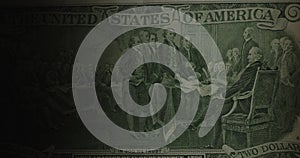 Two dollars bill of US. Slider shot of 2 dollars note. 2 bucks on black.