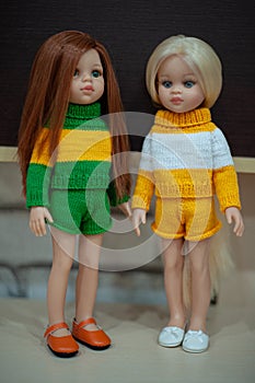 Two dolls in beautiful summer clothes.