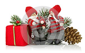 Two dolls with pine cone, gift box and spruce branches. Christmas ornaments isolated on white background