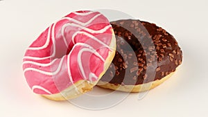 Two donuts isolates. Sweets and pastries close-up. two colorful glazed donuts