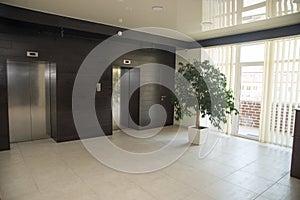 Two doors of elevators in modern business building.