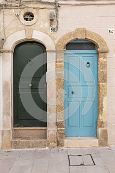 Two doors facade of old town in Polignano a Mare