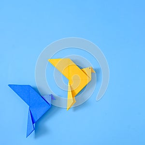 Two doves of peace on a blue background from a polygonal geometric