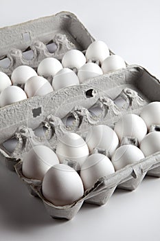Two Dozen White Eggs Inside Egg Cartons photo