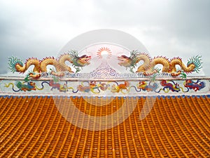 two dragon mosaic on roof sun flare lantern chinese art