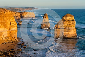 Two of the dramatic Twelve Apostles at sunset