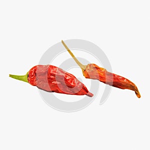 Two dried red hot chili peppers, isolated on a white background