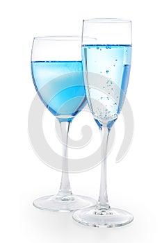 Two drinking glasses with blue liquid isolated with clipping pat